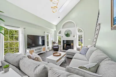 a living room with a large couch and a tv at 13-Acre Private Estate, Private Lake, Private Golf Range, Private Forest & Hiking Trails in Ross Corner