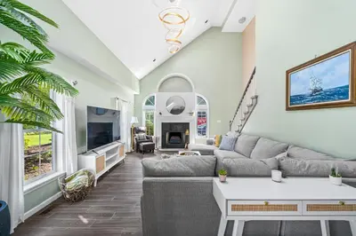 a living room with a couch and a tv at 13-Acre Private Estate, Private Lake, Private Golf Range, Private Forest & Hiking Trails in Ross Corner