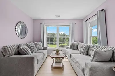 a living room with a couch and a table at 13-Acre Private Estate, Private Lake, Private Golf Range, Private Forest & Hiking Trails in Ross Corner