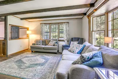 a living room with a couch and chairs and windows at Sparrow Bush Retreat with Pool and Screened Porch in Sparrow Bush