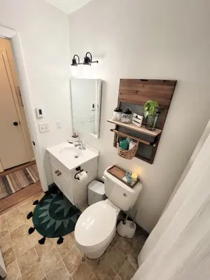 a bathroom with a toilet and a sink at 3 bedroom Rental pet friendly, fireplace, hot tub, near ski resorts in Albrightsville