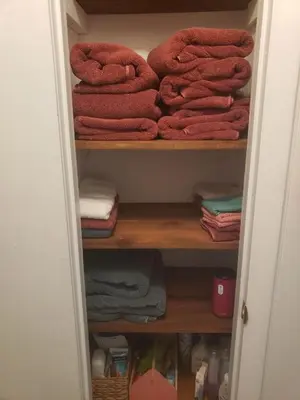 a closet filled with lots of red towels at 3 bedroom Rental pet friendly, fireplace, hot tub, near ski resorts in Albrightsville
