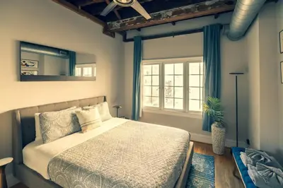 a bedroom with a large bed and a window at StayRafa At 253 3F in Philadelphia