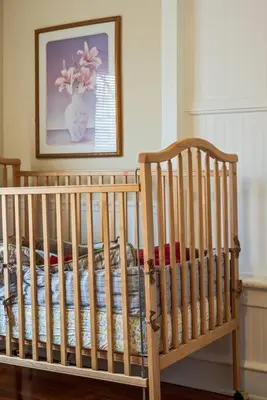 a crib in a room with a picture on the wall at 5 Bdrm House (Sleeps 10) Horsham-Philadelphia in Horsham