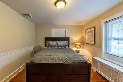 a bedroom with a bed in a room with a window at 5 Bdrm House (Sleeps 10) Horsham-Philadelphia in Horsham