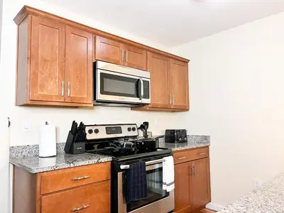 a kitchen with a stove and a microwave at Hidden Gem in Philadelphia