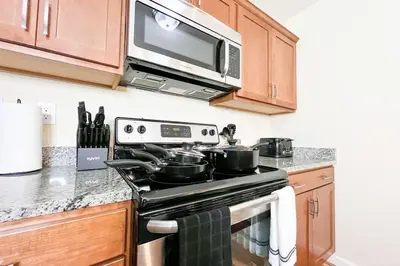a kitchen with a stove and a microwave at Hidden Gem in Philadelphia