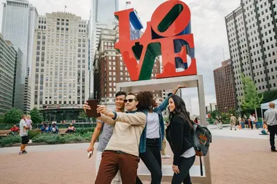 a group of people standing in front of a large sign at Hidden Gem in Philadelphia