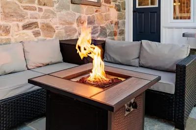 a fire pit in the middle of a patio at The Craftsman's Homestay in Gordonville