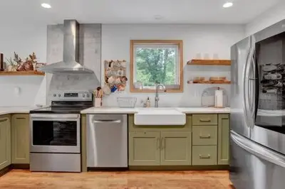 a kitchen with green and white appliances and a window at Evergreen Escape - Jim Thorpe Multi Ski Resort in Albrightsville