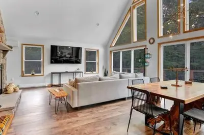 a living room with a couch and a table at Evergreen Escape - Jim Thorpe Multi Ski Resort in Albrightsville