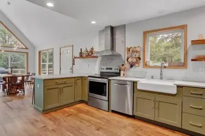 a large kitchen with a sink and a stove at Evergreen Escape - Jim Thorpe Multi Ski Resort in Albrightsville