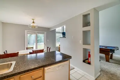 a kitchen and dining room with a pool table at Near Big Boulder Mtn! Home with Fireplace and Games in Lake Harmony