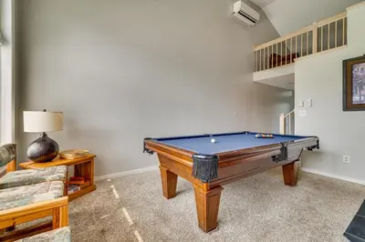 a pool table in a living room with at Near Big Boulder Mtn! Home with Fireplace and Games in Lake Harmony