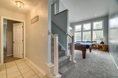 a living room with a pool table and a stairway at Near Big Boulder Mtn! Home with Fireplace and Games in Lake Harmony