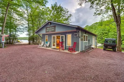 a small house with a truck parked in front of it at Near Big Boulder Mtn! Home with Fireplace and Games in Lake Harmony