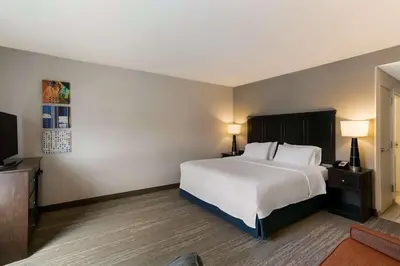a hotel room with a bed and a television at Hampton Inn & Suites Wilmington Christiana in Newark