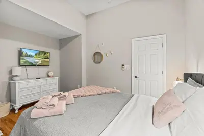 a bedroom with a bed with pink towels on it at Beautiful 1BD With Balcony Hosted By StayRafa - 2F in Philadelphia