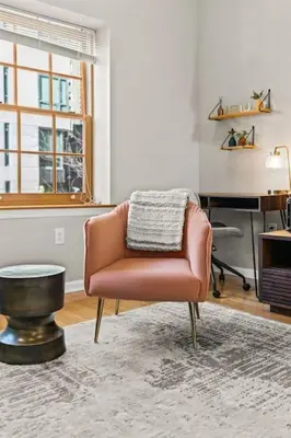 a living room with a chair and a desk at Beautiful 1BD With Balcony Hosted By StayRafa - 2F in Philadelphia
