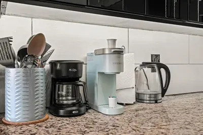 a kitchen counter with various appliances on a counter top at Beautiful 1BD With Balcony Hosted By StayRafa - 2F in Philadelphia