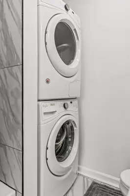a washer and a washing machine in a bathroom at Beautiful 1BD With Balcony Hosted By StayRafa - 2F in Philadelphia