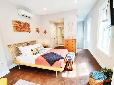 a bedroom with a bed and a dresser at Charming 1BDR In Central Rittenhouse Square With Patio Hosted by StayRafa in Philadelphia