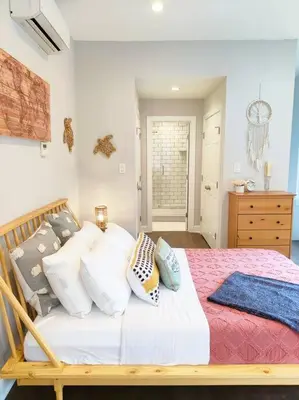a bedroom with a bed with pillows on it at Charming 1BDR In Central Rittenhouse Square With Patio Hosted by StayRafa in Philadelphia