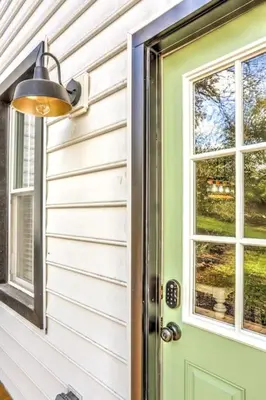 a green door with a window on a house at Beautiful Farmhouse close to Lanc Hershey Etown in Mount Joy