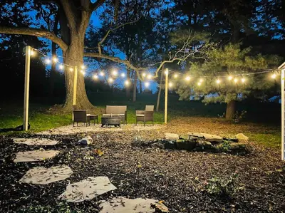 a group of chairs and lights in a park at night at Beautiful Farmhouse close to Lanc Hershey Etown in Mount Joy