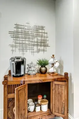 a wooden cabinet with a coffee maker on top of it at The Conservatory-20 min to Lanc in Mount Joy