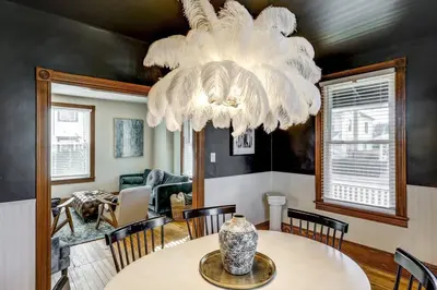 a dining room with a table and a chandelier at The Conservatory-20 min to Lanc in Mount Joy