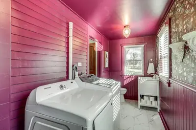 a pink bathroom with a sink and a toilet at The Conservatory-20 min to Lanc in Mount Joy