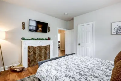 a bedroom with a bed and a fireplace at Victorian Manor on Main w 6 beds-10 mins to Lanc in Mountville