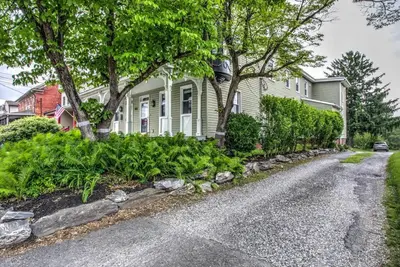 a house with trees and plants in the driveway at Victorian Manor on Main w 6 beds-10 mins to Lanc in Mountville
