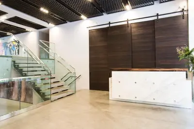 a lobby with a staircase and a wall of glass at Chelsea 1BR w Balcony Doorman Gym NYC-135 in New York