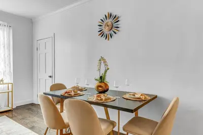 a dining room with a table and chairs at 2Bd Stylish Brooklyn Heights - Steps WaterFront in Brooklyn