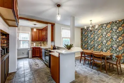 a kitchen with a table and a dining room at Cozy Dark & Moody Home New Reno 10 mins to Lanc in Mountville