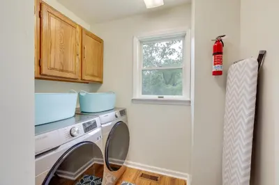 a washing machine in a laundry room with a window at Pennington Home with Deck about 9 Mi to Princeton! in Pennington