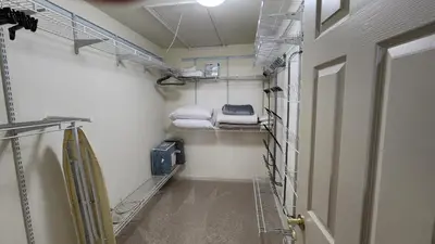 a room with a hallway with shelves and towels at Entire townhouse close to Hershey Park in Enola