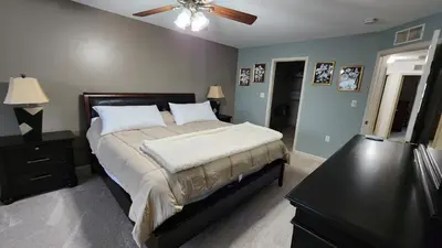 a bedroom with a bed and a ceiling fan at Entire townhouse close to Hershey Park in Enola