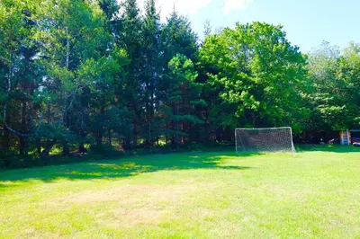 a field with a soccer goal in the grass at Farm Country House with Pool and Huge Property in Blakeslee