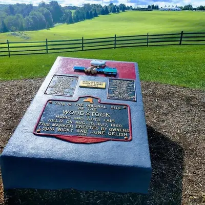 a monument with a gun on top of a field at Bethel Woods Cabin in Mongaup Valley