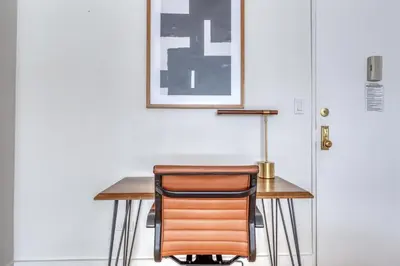 a desk with a chair next to a door at Midtown E 1BR w Gym Doorman nr the 6 NYC-4 in New York