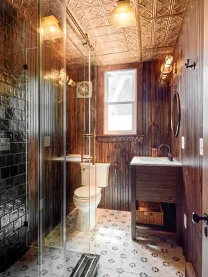 a bathroom with a toilet and a shower and a sink at Luxuriously Restored Farm Cabin in Mountainhome