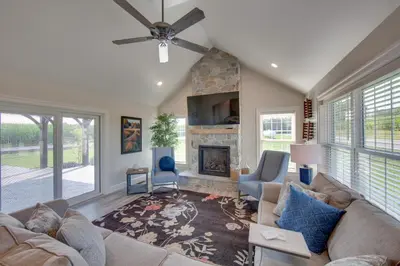 a living room with a couch and a fireplace at Patio and Yard Newly Built Retreat in Ronks! in Ronks