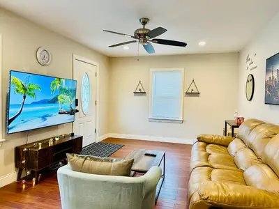 a living room with a couch and a flat screen tv at Campu’s House - HOME SWEET HOME in Cherry Hill in Cherry Hill