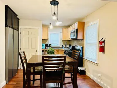 a kitchen with a dining room table and chairs at Campu’s House - HOME SWEET HOME in Cherry Hill in Cherry Hill