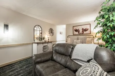 a living room with a couch and a table at Country Living Inn in Lancaster