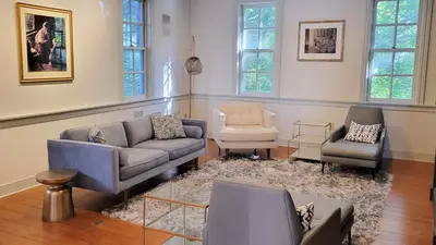 a living room with couches and chairs in a room at Pinetown Bridge Bnb LLC in Leola