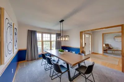 a dining room with a wooden table and chairs at Game Room and Covered Patio Hummelstown Hideaway in Hummelstown